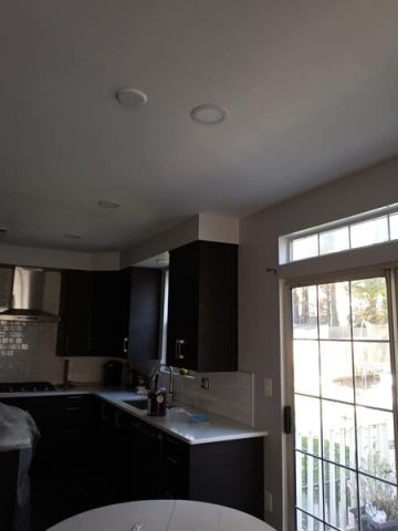 Uceda Painting Services LLC finishes cabinets in Vienna